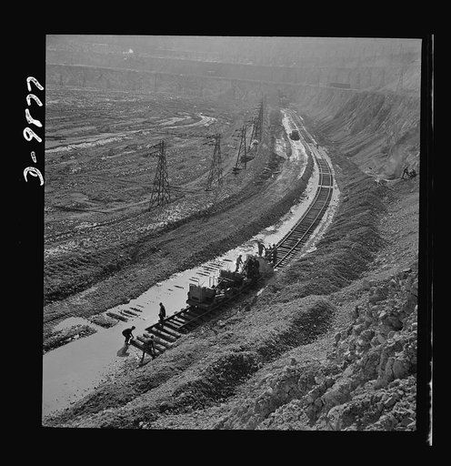 Utah Copper: Bingham Mine. Track-laying crew at open-pit mining operations of Utah Copper Company at Bingham Canyon, Utah