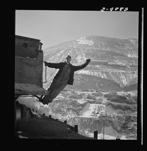 Utah Copper: Bingham Mine. Brakeman of an ore train at the open-pit mining operations of Utah Copper Company, at Bingham Canyon, Utah