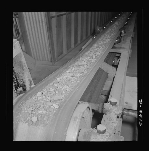 Production. Tungsten. Tungsten ore traveling on a belt conveyor at a concentrating plant near Kingman, Arizona. The Boriana mine and plant at this point are producing large amounts of tungsten, for which there are many vital uses in the war effort. Boriana Mine, Arizona
