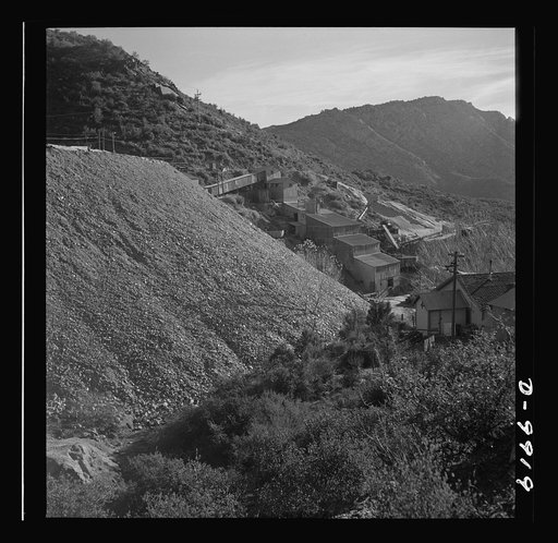 Production. Tungsten. A waste pile near a tungsten recovery plant close to Kingman, Arizona. The Boriana mine and plant at this point are producing large amounts of tungsten, for which there are many vital uses in the war effort. Boriana Mine, Arizona