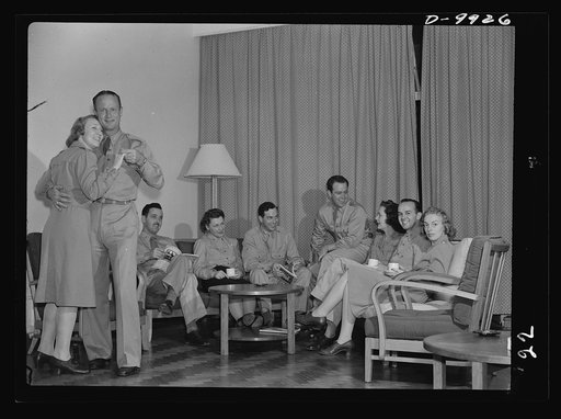Reciprocal aid. American nurses and officers enjoy themselves in nurses' quarters of a new 3,000,000 dollar hospital "somewhere in Australia" which government of Australia has provided, without payment by the United States, for American servicemen recuperating from wounds and illness. Hospital is on