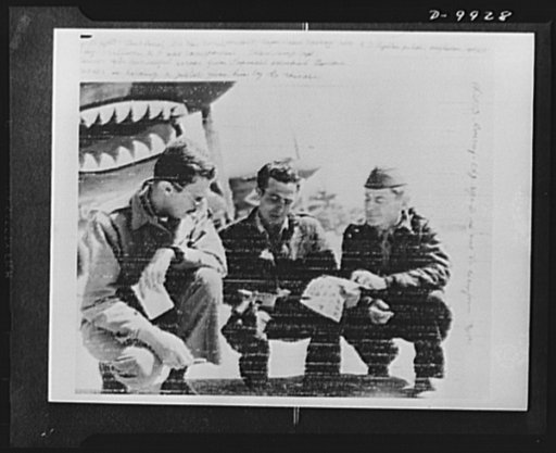 Fighter pilot interviewed after escape. Left to right: Jack Jarrel, INS correspondent; Captain Jesse Carney, 14th Air Force fighter pilot, Hoylwan, Oklahoma; Riley O'Sullivan, Associated Press war correspondent interviewing Captain Carney after successful escape from Japanese-occupied Burma. Carney 