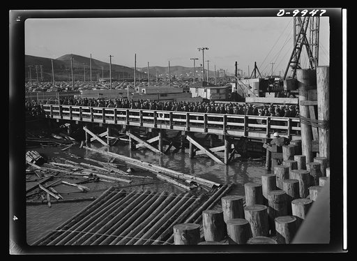California shipyard workers. Thousands of workers bound for the Richmond shipyards in San Francisco's East bay area leave the ferry and cross the ramp leading to the yards