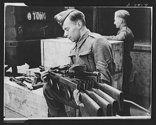 Lend-Lease to Britain. Tommy-guns arriving in England from the United States under lend-lease are unpacked and checked by an ordnance corporal. The guns arrived complete, ready to be fired