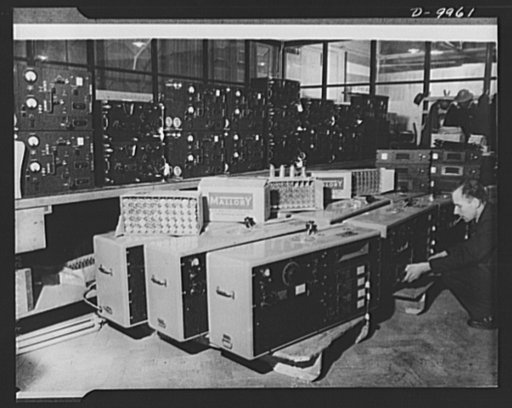 Lend-Lease to Britain. Radio outfits shipped from the United States under lend-lease arrive at an ordnance depot in England. They include reception sets spare valves and (on shelf) American tank radio sets
