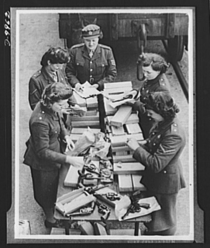 Lend-Lease to Britain. American-made 38-caliber revolvers shipped to England from the United States under lend-lease are unpacked at an English ordnance depot