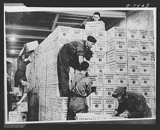 Lend-Lease to Britain. Cases of TNT gunpower shipped from the United States under lend-lease are stacked in the dump in a tunnel one hundred feet underground dug out of solid rock in western England. The staff here works twenty-four hours a day handling Lend-Lease materials arriving from the United 