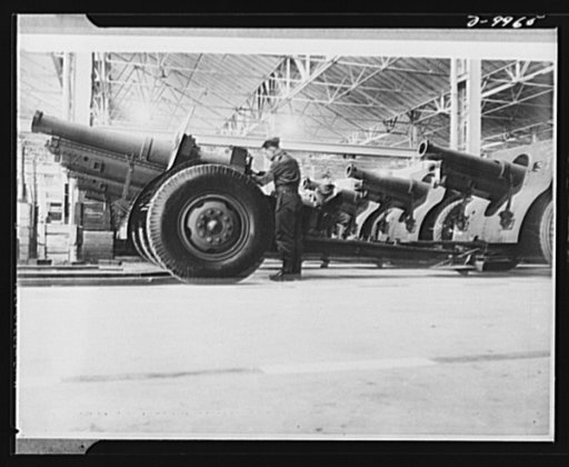 Lend-Lease to Britain. A shipment of 155 mm. howitzers just arrived from the United States under lend-lease is prepared for service at an ordnance depot in England