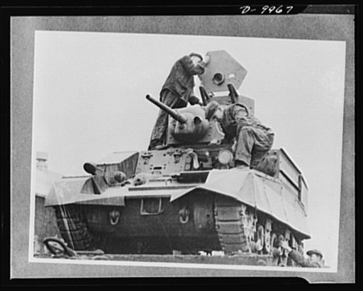 Lend-Lease to Britain. An American light tank is unloaded at a central ordnance depot in England, part of a lend-lease shipment from the United States