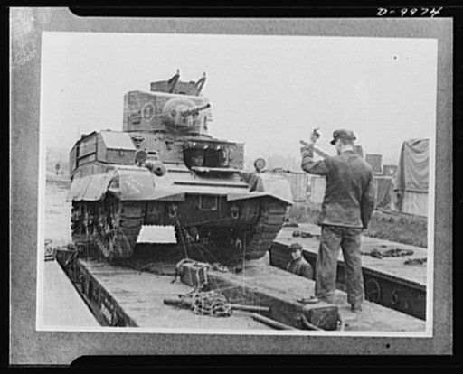 Lend-Lease to Britain. An American light tank is unloaded at a central ordnance depot in England, part of a lend-lease shipment from the United States