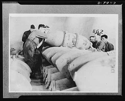 Lend-Lease to Britain. American 1,100-pound bombs to be used by the Royal Air Force are stacked in an ammunition dump in England, after arriving from the United States in a lend-lease shipment. The dump is in a tunnel one hundred feet underground hewn from solid rock