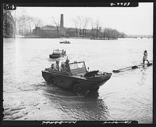Sea jeeps. Successfully crossing a fast-flowing stream, the Ford-built amphibian, with full complement of four soldiers, easily climbs opposite shore and is ready for any scouting operations. Picture shows maneuvers recently held in the Detroit area, when soldiers from Fort Wayne in full combat dres