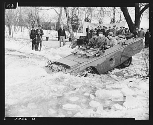 Sea jeeps. Ice is no barrier to the Ford-built amphibian car. Here one dives into the ice from a river bank in the Detroit area as the three passengers hold on
