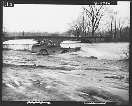Sea jeeps. The Army's most flexible new machine of the war, a Ford-built amphibian reconnaissance car, carrying soldiers equipped for combat duty takes to the water in special tests staged recently in the Detroit area. This picture shows how the new transportation arm propelling itself as a boat to 