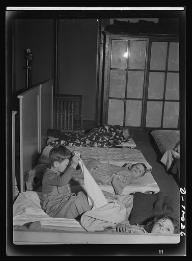 War workers' nursery. Two or three hours of rest every afternoon is part of a modern day nursery's schedule. These children of war-working mothers are settling down for naps after a morning of indoor and outdoor play