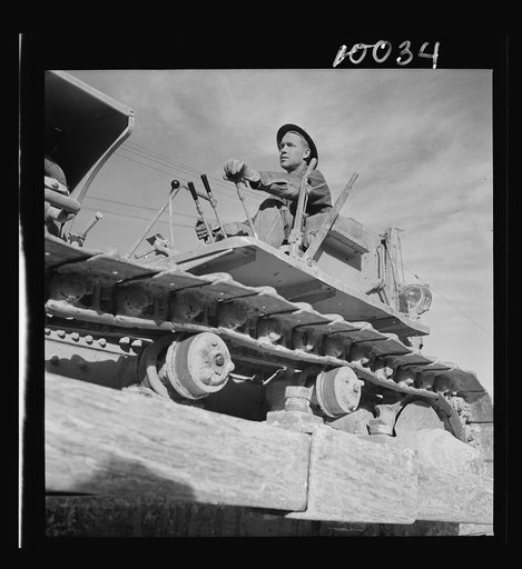 Production. Copper. Bulldozer operator at open-cut copper mine of the Phelps-Dodge Mining Company at Morenci, Arizona, supplying great quantities of the copper so vital in our war effort