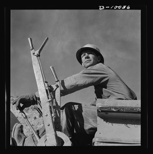 Production. Copper. Bulldozer operator at open-cut copper mine of the Phelps-Dodge Mining Company at Morenci, Arizona, supplying great quantities of the copper so vital in our war effort