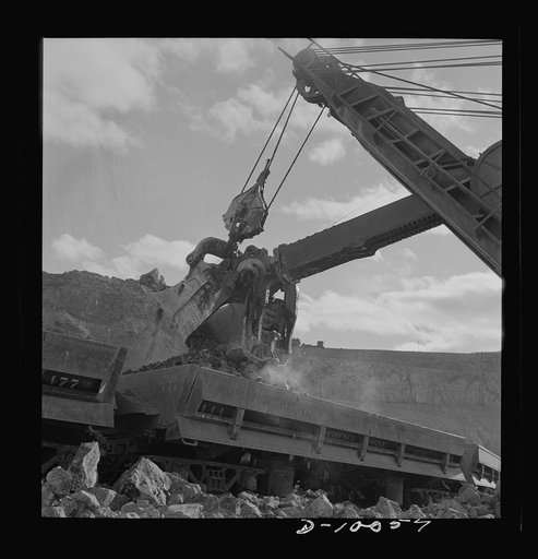 Production. Copper. Loading copper ore from an open-cut mine of the Phelps-Dodge Mining Company at Morenci, Arizona. This plant is supplying great quantities of the copper so vital in our war effort