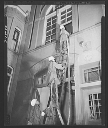 Office of Civilian Defense worker help protect nation's capital. Fully equipped to cope with any situation they may encounter are the volunteer auxiliary firemen of Washington, D.C. Trained to fight incendiary and fires of other causes during raids, they are shown carrying hose into a building durin