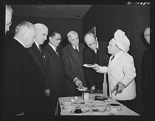 Maxim Litvinov, Russian ambassador; Edward R. Stettinius, Jr., lend-lease administrator; T.V. Soong, Chinese foreign minister; Secretary of Commerce Jesse Jones, and Lord Halifax, British ambassador, examine dehydrated food at the Hotel Statler, where a a luncheon of dehydrated food was served on Ma