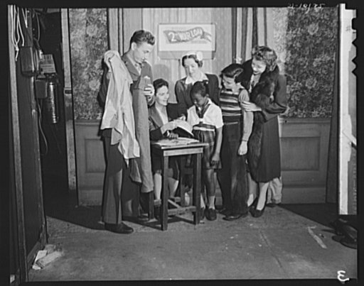 Helen Hayes and cast buy bonds to outfit fighting men. Helen Hayes and members of the cast of "Harriet" lined up in New York to buy bonds in the second War Loan Drive to help Uncle Sam furnish clothing and personal equipment for his fighting men. Private John Patrick Cooper holds part of a soldier's