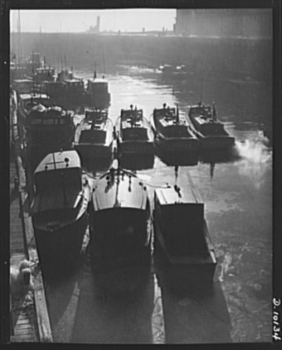 Coast Guard Auxiliary. Guardians of inland waters. At the Lewis wharf of Coast Guard headquarters in Boston, small craft made available by members of the auxiliary are lined up alongside of Coast Guard vessels
