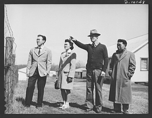 Three Japanese-Americans from the Colorado River Relocation Center are being shown their new places of work by Sam Rice, former major league baseball player, owner of a chicken farm near Olney, Maryland. Left to right are William Kobayashi, his wife Betty; Mr. Rice and Giichi Omari