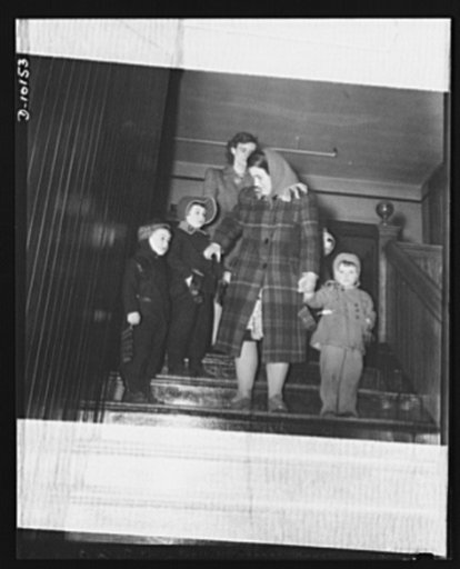 War nursery schools. Providence, Rhode Island. Mothers who work in war plants call for their children at a war nursery in the Chalkstone Avenue School in Providence. This Chalkstone Avenue war nursery is one of thirty-five in Rhode Island for pre-school children whose mothers are employed in war wor