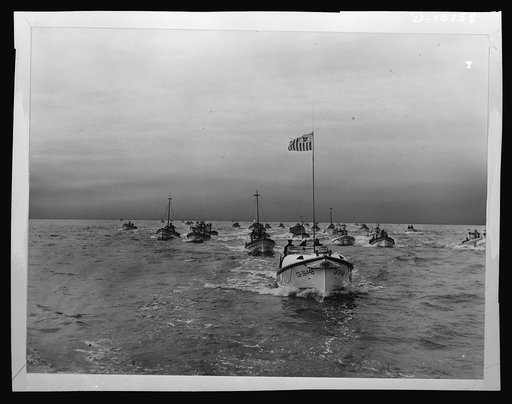 A Coast Guard motor lifeboat provides escort to San Francisco's crab fishermen as a wartime precaution. This naval protection includes taking the fleet to the fishing grounds at dawn, remaining with it through the fishing hours and finally bringing it home through the Golden Gate in the late afterno