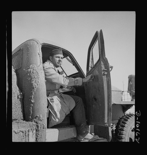 Correspondent overseas. Tex O'Reilly, war correspondent for the New York Herald Tribune, as he gathered story material on U.S. Army truck convoy carrying supplies for Russia through the Persian corridor