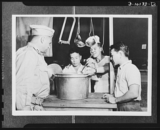 Japanese-American volunteers. This is the Army, Shuichi "Pete" Sakamoto, surveyor and civil engineer, and Bill Shiramizu of Hanamaulu, are told by Captain C.J. White, commanding officer of the provisional company of AJA (Americans of Japanese ancestry) volunteers on Kauai, as they spend their first 