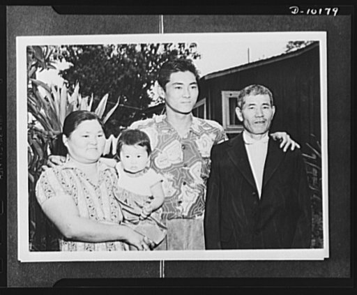 Japanese-American volunteers. "I am very happy that my son is the first man inducted," Harue Doi, thirty-eight, of Lihue, Kauai said in broken English as he posed with his son Mitsuru, eighteen, first AJA [Americans of Japanese ancestry] volunteer in the territory to be inducted into the AJA combat 