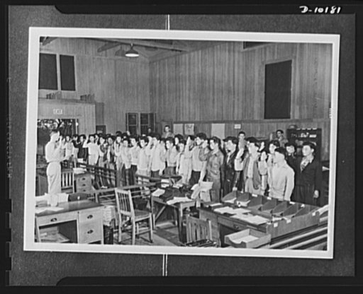Japanese-American volunteers. The remaining fifty-three volunteers of board no. 2, Lihue, Kauai, who passed their physical to complete their board's quota of fifty-eight inductees take the oath of induction into the AJA [Americans of Japanese ancestry] combat regiment. The oath is administered by Ma
