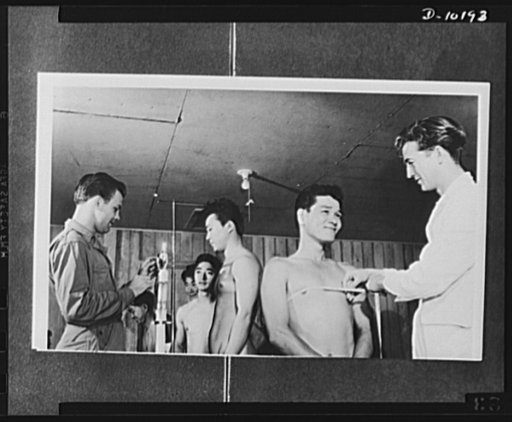 Japanese-American volunteers. Weight, height and chest measurements, all were taken in a simultaneous operation as AJA [Americans of Japanese ancestry] volunteers on Kauai, Hawaii, first island to begin induction into the new combat unit, underwent physical examination prior to induction of 150 men