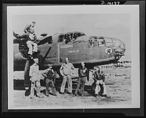 Veterans of the Medium Bomber Squadron 14th Airforce who blasted Tokyo with General Doolittle and are still dealing aerial blows to Japs in occupied China, Burma. Standing, left to right: Lieutenant Youngblood, Houston, Texas; Captain Crouch, Columbia, South Carolina; Lieutenant Mauch Staunton, Virg
