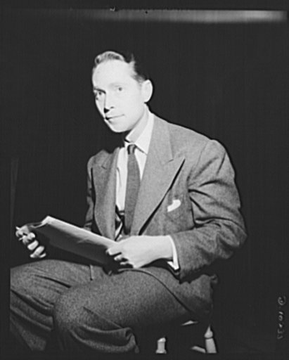 Three Thirds of the Nation. Franchot Tone perches on high stool, watches the control booth for cue during presentation of War Production Board (WPB) radio show Three Thirds of the Nation, June 3, 1942