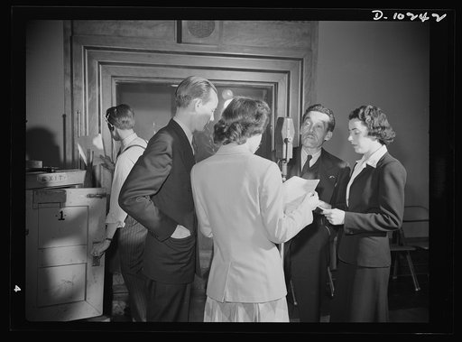 "You Can't Do Business With Hitler." Rehearsal is underway for the radio show "You Can't Do Business With Hitler" written and produced by the radio section of the Office of War Information (OWI). At the microphone are (left to right) Sam Lauder, Marian Harvey (with back turned), Robert Pollard and I