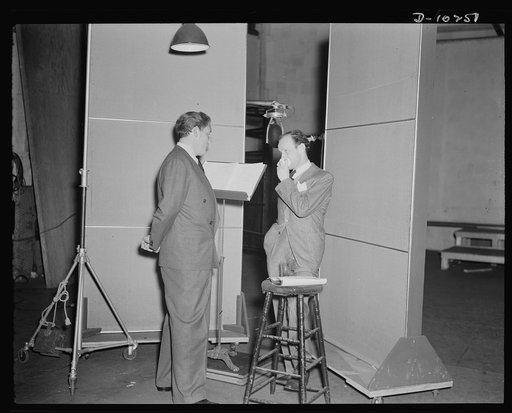 Spencer Tracy, narrator and Garson Kanin, director, at the Long Island Studios of the Army Signal Corps for the recording of Spencer Tracy's narration of the "Ring of Steel," an Office of Emergency Management film (OEM), on February 19th, 1942