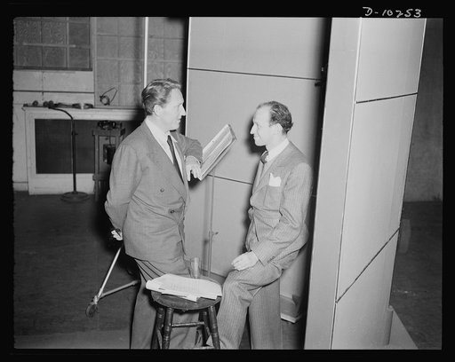 Spencer Tracy, narrator and Garson Kanin, director, at the Long Island Studios of the Army Signal Corps for the recording of Spencer Tracy's narration of the "Ring of Steel," an Office of Emergency Management (OEM) film, on February 19th, 1942