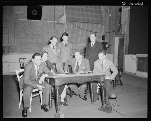 Jack Schaindlin, musical director, Eleanor Herring, Garson Kanin, director, Wallace Russell, writer, Spencer Tracy, narrator, Max Brasch, film editor, Philip Martin, Jr., technical director, at the Long Island Studios of the Army Signal Corps for the recording of Spencer Tracy's narration of the "Ri