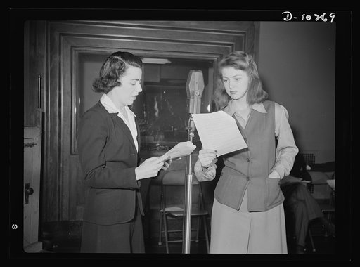 "You Can't Do Business With Hitler." Ilona Killian (left) and Virginia Moore are rehearsing for "You Can't Do Business With Hitler" radio show, written and produced by the radio section of the Office of War Information (OWI). This series of programs is broadcast by 790 stations throughout the countr