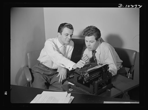 "You Can't Do Business With Hitler," a series of radio shows, written and produced by the radio section of the Office of War Information (OWI), is transcribed four times a month. Elwood Hoffman (left) writes the scripts, and Frank Telford directs the production