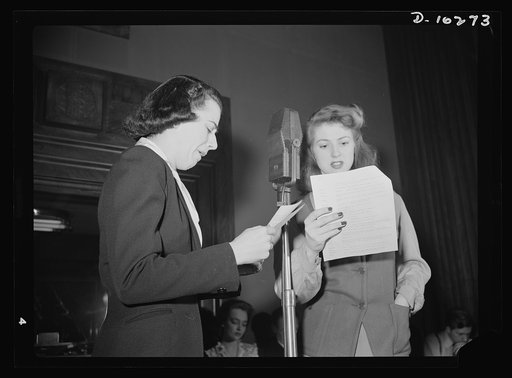 "You Can't Do Business With Hitler." Ilona Killian (left) and Virginia Moore are members of the cast of "You Can't Do Business With Hitler" radio show, written and produced by the radio section of the Office of War Information (OWI). This series of programs is broadcast by more than 790 radio statio