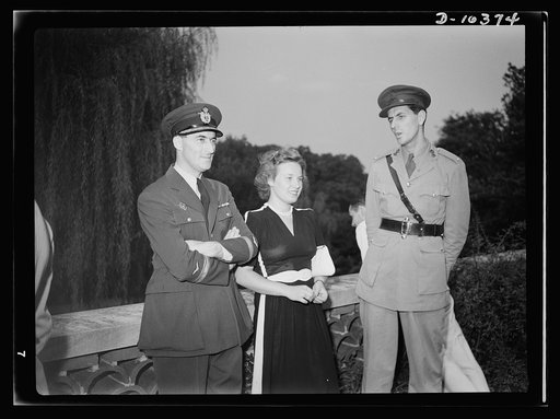 The uniforms are different but the cause is the same. Officers of the United Nations attend a garden party of the United Nations Club at Dumbarton Oaks, Sunday, September 6th, 1942. Left to right: Major M.V. Mishovich, Assistant Military Attache, Yugoslavia; Miss Marica Chok; Major Reginald Williams