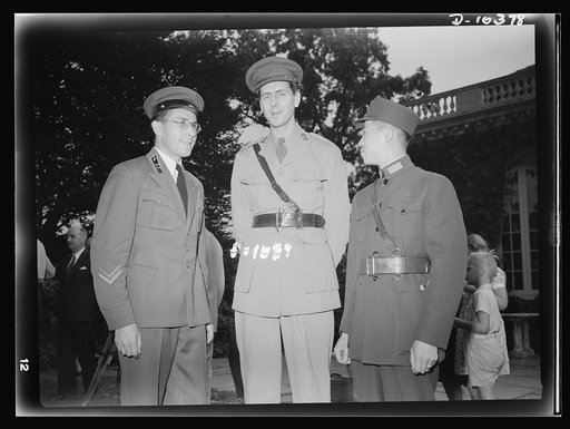 The uniforms are different but the cause is the same. Officers of the United Nations attend a garden party of the United Nations Club at Dumbarton Oaks, Sunday, September 6th, 1942. Left to right: Major Barayev, Assistant Military Attache, Russian Embassy; Major Reginald Williams, Military Attache, 