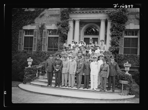 The uniforms are different, but the cause is the same. Officers of the United Nations attend a garden party of the United Nations Club at Dumbarton Oaks