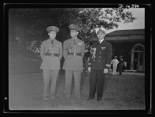 The uniforms are different but the cause is the same. Officers of the United Nations attend a garden party of the United Nations Club at Dumbarton Oaks, Sunday, September 6, 1942. Left to right: Lieutenant Colonel P.A. Jose Perez Allende, Mexican Air Corps; General Sanchez Hernandez, Mexico; Lieuten