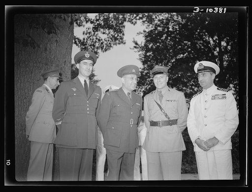 The uniforms are different but the cause is the same. Officers of the United Nations attend a garden party of the United Nations Club at Dumbarton Oaks, Sunday, September 6, 1942. Left to right: Major M. V.  Mishovich, Assistant Military Attache, Yugoslavia; Colonel O. Spaniel, Czechoslovakia; Major