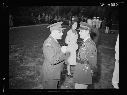 The uniforms are different but the cause is the same. Officers of the United Nations attend a garden party of the United Nations Club at Dumbarton Oaks, Sunday, September 6, 1942. Left to right: Colonel O. Spaniel, Czechoslovakia; Colonel R. B. Larouche, Military Attache Haitian Legation