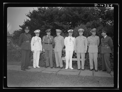 The uniforms are different but the cause is the same. Officers of the United Nations attend a garden party of the United Nations Club at Dumbarton Oaks, Sunday, September 6, 1942. Left to right: Colonel Felix Castellano, Military Attache, Guatemala; Lieutenant Colonel Felipe Munilla, Cuba; Colonel H